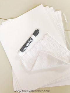 White card stock, sheet protectors, washcloth, and Expo marker